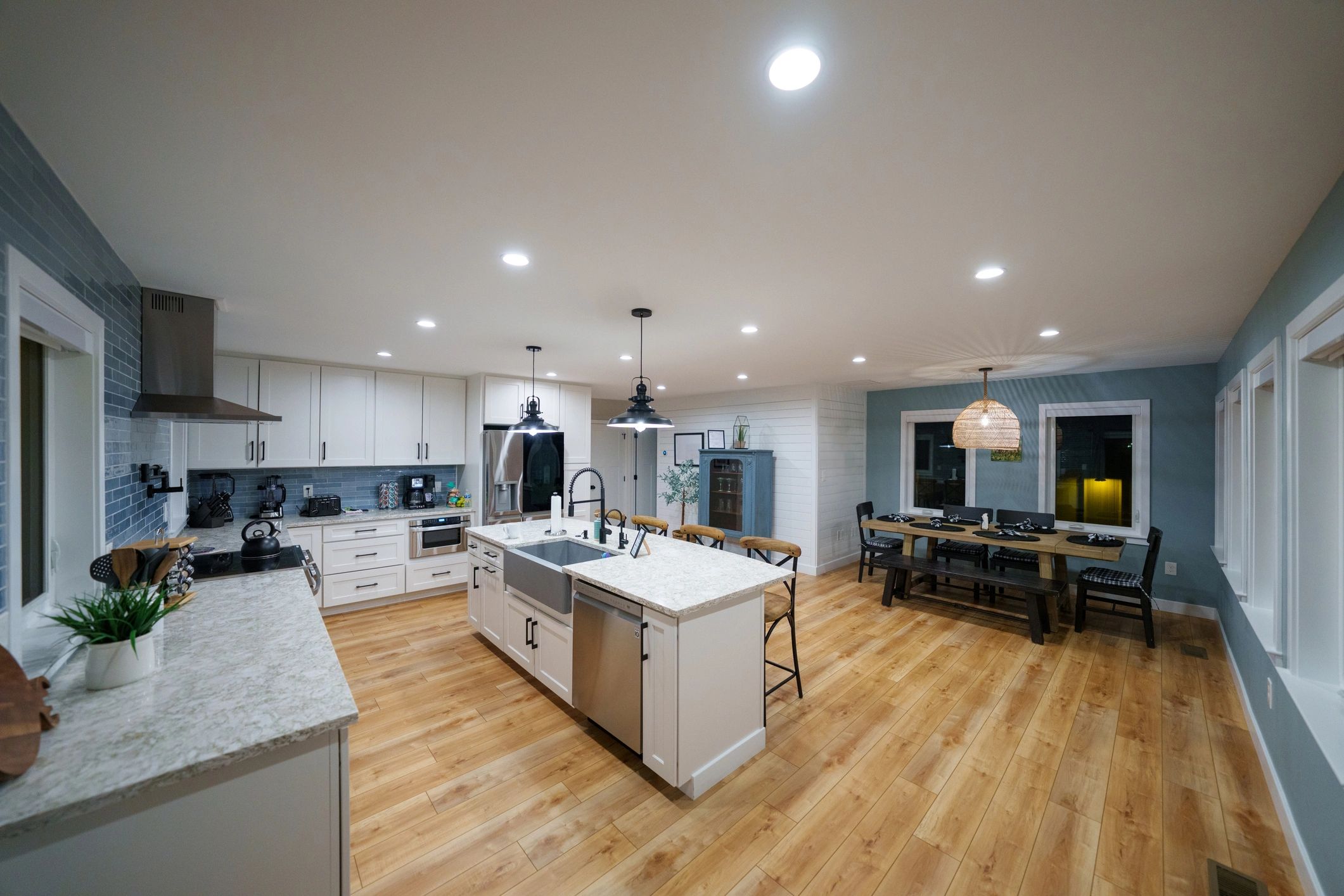 Modern remodeled kitchen with island and dining area