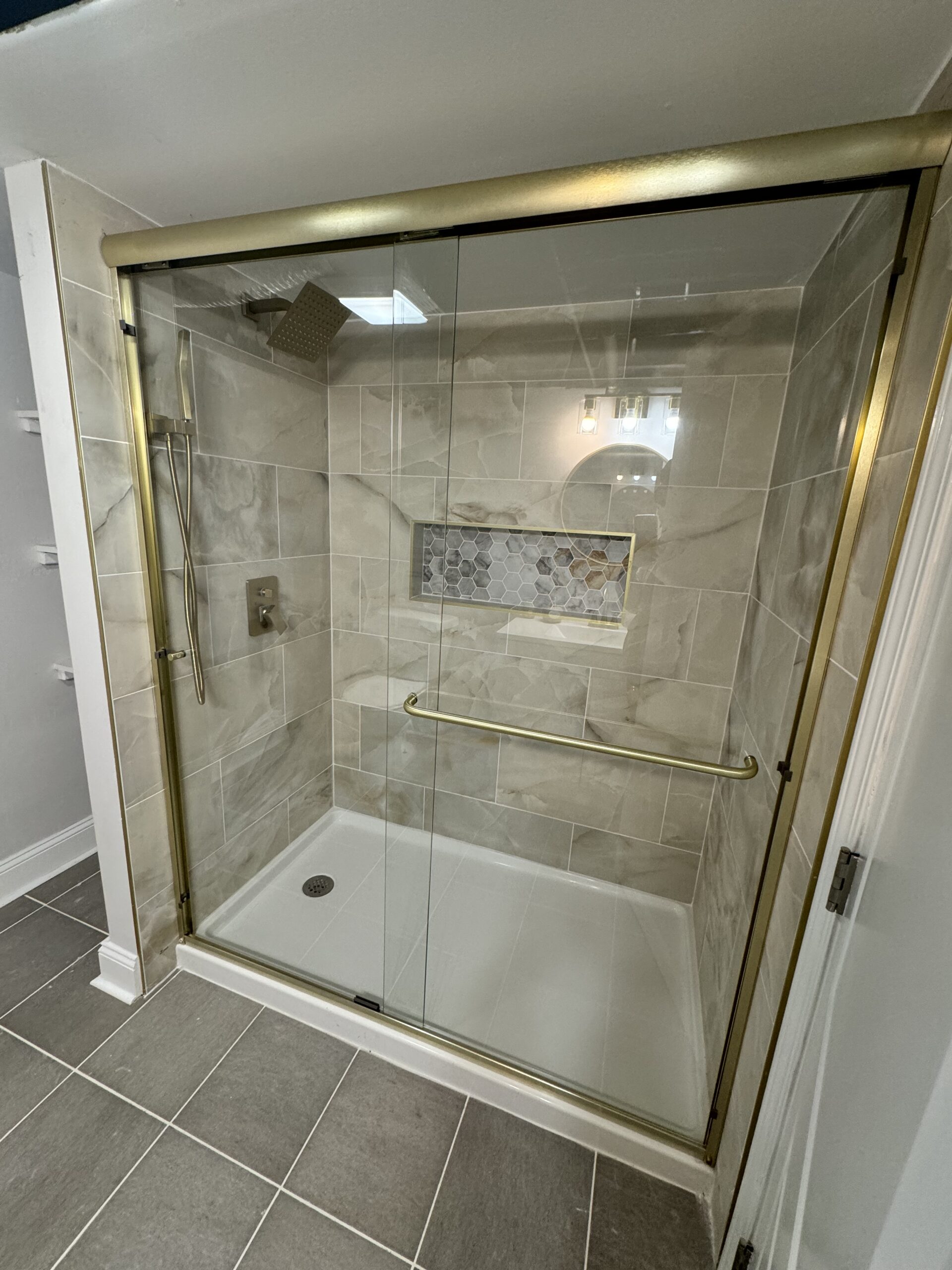 Updated bathroom with vanity, mirror, and clean modern finishes